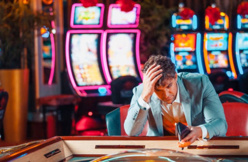 Person loosing money on counterfeit games